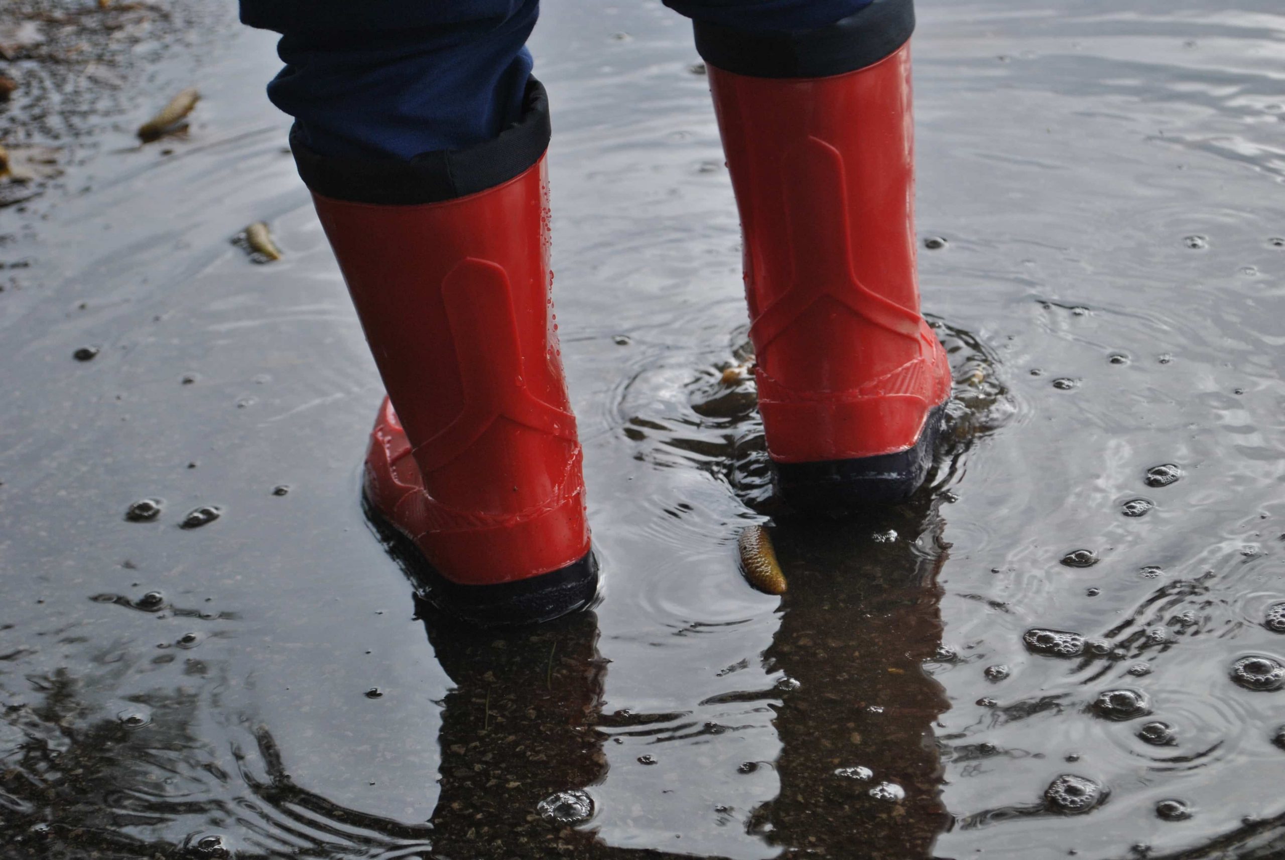 Feet with boots while raining