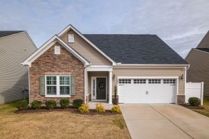 A house with a driveway and a lawn in Tulsa, OK