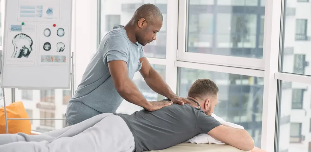 A man massaging a man's back