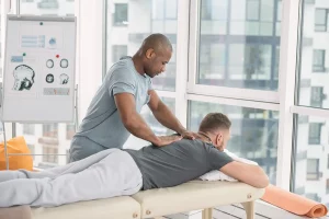 A man massaging a man's back