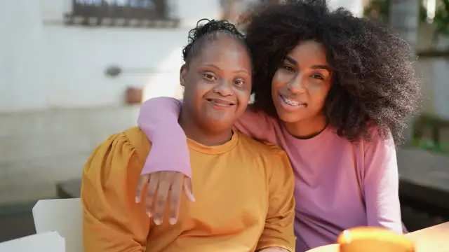 A woman hugging another woman