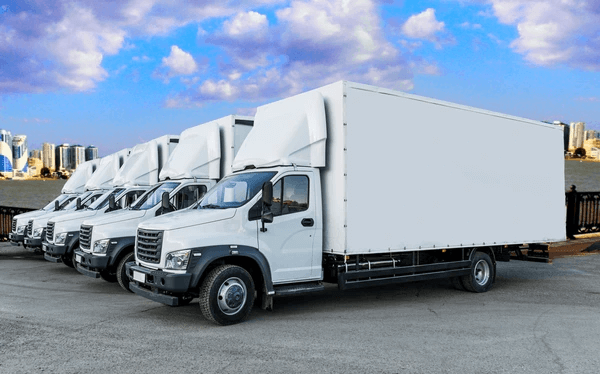 A row of white commercial trucks in Tulsa, OK