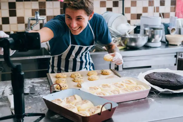 a man taking a video while baking