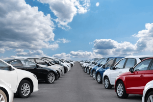 a row of cars parked in a lot