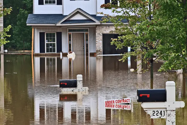 a house flooded with water in Fayetteville, AR