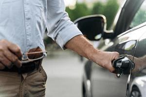 a man opening a car door