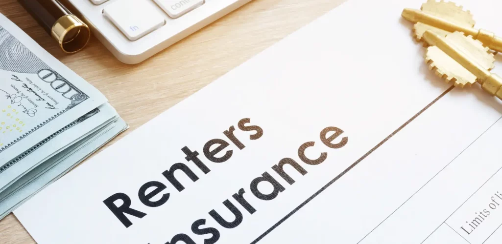 a pen and renters insurance form on a desk