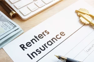 a pen and renters insurance form on a desk