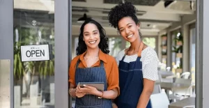 a couple of women wearing aprons