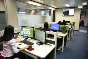 a group of people working in an office