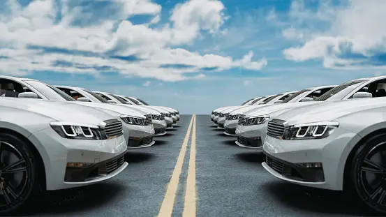 a row of cars parked on a road