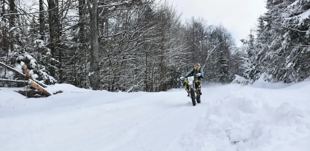 Rider driving a motorcycle in cold winter conditions