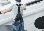 a man repairing an RV roof in Fayetteville, AR