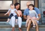 a family sitting on steps talking about life insurance in Arkansas